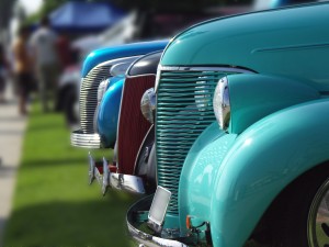 cars lined up at a vintage car show